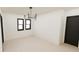 Minimalist bedroom with natural light, hardwood floors, and modern lighting fixtures at 458 Shannon Sw Dr, Atlanta, GA 30310