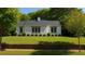 Charming single-story home featuring a well-manicured front yard and classic white exterior at 458 Shannon Sw Dr, Atlanta, GA 30310