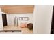 Hallway featuring wood ceiling, decorative mirror, bench, and stylish accents at 458 Shannon Sw Dr, Atlanta, GA 30310