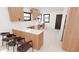 Modern kitchen with sleek countertops, wood cabinets, stainless steel appliances, and bar seating at 458 Shannon Sw Dr, Atlanta, GA 30310