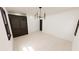 Spacious living room featuring hardwood floors, modern chandelier, and a large window for ample light at 458 Shannon Sw Dr, Atlanta, GA 30310