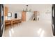 Bright, open living space with hardwood floors, modern lighting, and seamless kitchen connection at 458 Shannon Sw Dr, Atlanta, GA 30310