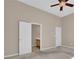 Bedroom featuring neutral tones, a ceiling fan, and an ensuite bathroom at 5040 Stonehaven Vw, Cumming, GA 30040