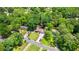 Aerial view of a home nestled among lush green trees in a residential area at 919 Rock Oak Ln, Lawrenceville, GA 30046