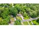 Aerial view of a charming home with a well-manicured lawn and driveway at 919 Rock Oak Ln, Lawrenceville, GA 30046