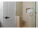 Shower room featuring light tile and a glass door at 919 Rock Oak Ln, Lawrenceville, GA 30046
