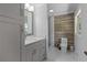 Bathroom featuring a tile shower and large vanity at 919 Rock Oak Ln, Lawrenceville, GA 30046