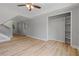 Bright bedroom with wood flooring, closet, and natural light at 919 Rock Oak Ln, Lawrenceville, GA 30046