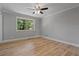 Bedroom with wood-look flooring and neutral walls at 919 Rock Oak Ln, Lawrenceville, GA 30046