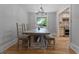 Traditional dining room features a chandelier, hardwood floors, a large dining table and bench at 919 Rock Oak Ln, Lawrenceville, GA 30046