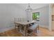 Traditional dining room with a chandelier, hardwood floors, a large dining table and bench at 919 Rock Oak Ln, Lawrenceville, GA 30046