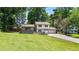 Charming home featuring a lush front lawn and a two-car attached garage at 919 Rock Oak Ln, Lawrenceville, GA 30046
