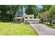 Charming home featuring a lush front lawn and a two-car attached garage at 919 Rock Oak Ln, Lawrenceville, GA 30046