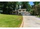 Charming home featuring a lush front lawn and a two-car attached garage at 919 Rock Oak Ln, Lawrenceville, GA 30046
