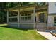 Spacious front porch with a ceiling fan and decorative railing at 919 Rock Oak Ln, Lawrenceville, GA 30046