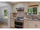 Stylish kitchen with granite countertops, stainless steel appliances, and eat-in area at 919 Rock Oak Ln, Lawrenceville, GA 30046