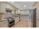 Modern kitchen featuring stainless steel appliances, granite countertops, and custom cabinetry at 919 Rock Oak Ln, Lawrenceville, GA 30046