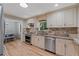Well-designed kitchen with granite counters, stainless appliances, and an attached dining room at 919 Rock Oak Ln, Lawrenceville, GA 30046