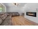 Spacious living room features hardwood floors, a fireplace, and large windows at 919 Rock Oak Ln, Lawrenceville, GA 30046