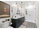 Elegant bathroom with a walk-in shower and dual vanity with attractive fixtures at 112 Rogers Street Ne # 410, Atlanta, GA 30317