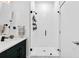 Modern bathroom featuring a glass-enclosed shower, sleek fixtures, and a white vanity at 112 Rogers Street Ne # 410, Atlanta, GA 30317