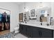 Bathroom with double vanity, pendant lights, and walk-in closet at 112 Rogers Street Ne # 410, Atlanta, GA 30317