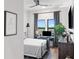 Bedroom features modern ceiling fan, neutral walls, and modern furniture at 112 Rogers Street Ne # 410, Atlanta, GA 30317