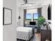 Stylish bedroom offering a dedicated workspace and streaming television at 112 Rogers Street Ne # 410, Atlanta, GA 30317