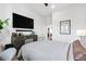 Comfortable bedroom with a flat screen tv and decorative elements at 112 Rogers Street Ne # 410, Atlanta, GA 30317