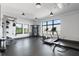 Well-equipped gym with modern exercise machines, weights, and large windows for a refreshing workout at 112 Rogers Street Ne # 410, Atlanta, GA 30317