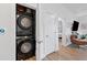 Efficient laundry room with full sized stacked washer and dryer unit at 112 Rogers Street Ne # 410, Atlanta, GA 30317