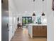 Open-concept kitchen and living area with modern decor and plenty of natural light at 112 Rogers Street Ne # 410, Atlanta, GA 30317