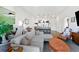 Inviting living area featuring an open floor plan, bar stools, modern decor, and stainless steel appliances at 112 Rogers Street Ne # 410, Atlanta, GA 30317