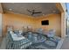 Stylish outdoor lounge area featuring comfortable seating, a ceiling fan, and a mounted television at 112 Rogers Street Ne # 410, Atlanta, GA 30317