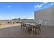 A relaxing rooftop terrace, with dining area and furniture perfect for outdoor entertaining and enjoyment of green views at 112 Rogers Street Ne # 410, Atlanta, GA 30317