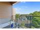 Cozy balcony seating area with views of the surrounding neighborhood at 112 Rogers Street Northeast Ne St # 410, Atlanta, GA 30317