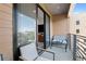 Comfortable balcony with seating and sliding glass doors at 112 Rogers Street Northeast Ne St # 410, Atlanta, GA 30317