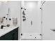 Sleek bathroom with a glass-enclosed shower and dark green vanity at 112 Rogers Street Northeast Ne St # 410, Atlanta, GA 30317