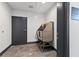 Dog spa with a stainless-steel dog bath and showerhead, with gray tile floors and a painted door at 112 Rogers Street Northeast Ne St # 410, Atlanta, GA 30317