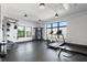 Bright gym featuring modern exercise equipment and large windows offering scenic views at 112 Rogers Street Northeast Ne St # 410, Atlanta, GA 30317