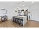 Modern kitchen with island, stainless steel appliances, and stylish pendant lighting at 112 Rogers Street Northeast Ne St # 410, Atlanta, GA 30317