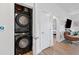 Convenient laundry area with a modern stacked washer and dryer unit at 112 Rogers Street Northeast Ne St # 410, Atlanta, GA 30317