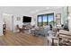 Spacious living room features hardwood floors, ample natural light, comfortable seating, and stylish furnishings with workspace at 112 Rogers Street Northeast Ne St # 410, Atlanta, GA 30317