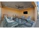 Relaxing covered patio with stylish furniture, a ceiling fan, and a wall-mounted TV at 112 Rogers Street Northeast Ne St # 410, Atlanta, GA 30317
