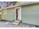 Exterior view of the back entrance with newly installed concrete steps and conveniently located laundry facilities at 2572 Bates Se St, Smyrna, GA 30080