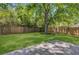 Expansive backyard featuring mature trees, a well-kept lawn, and wooden fencing for added privacy and security at 2572 Bates Se St, Smyrna, GA 30080