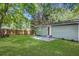 Well-maintained backyard offers a private retreat with lush lawn, a concrete patio, and a secure wooden fence at 2572 Bates Se St, Smyrna, GA 30080