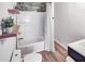 Bathroom features tiled shower and tub combo with neutral color palette at 2572 Bates Se St, Smyrna, GA 30080