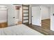 Bright bedroom features wood floors, modern doors, and ensuite bathroom at 2572 Bates Se St, Smyrna, GA 30080