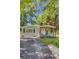 Inviting home features charming curb appeal, lush lawn, and a welcoming front entrance at 2572 Bates Se St, Smyrna, GA 30080